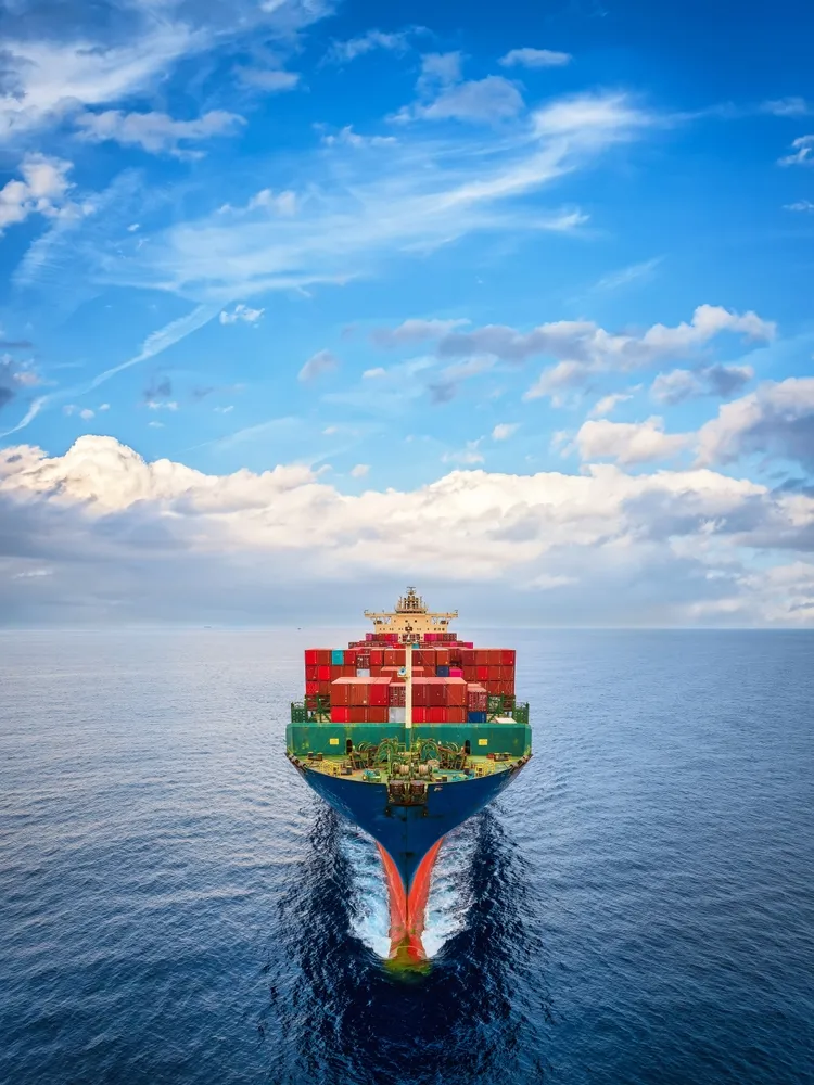 Aerial,Front,View,Of,A,Large,Container,Cargo,Ship,Sailing